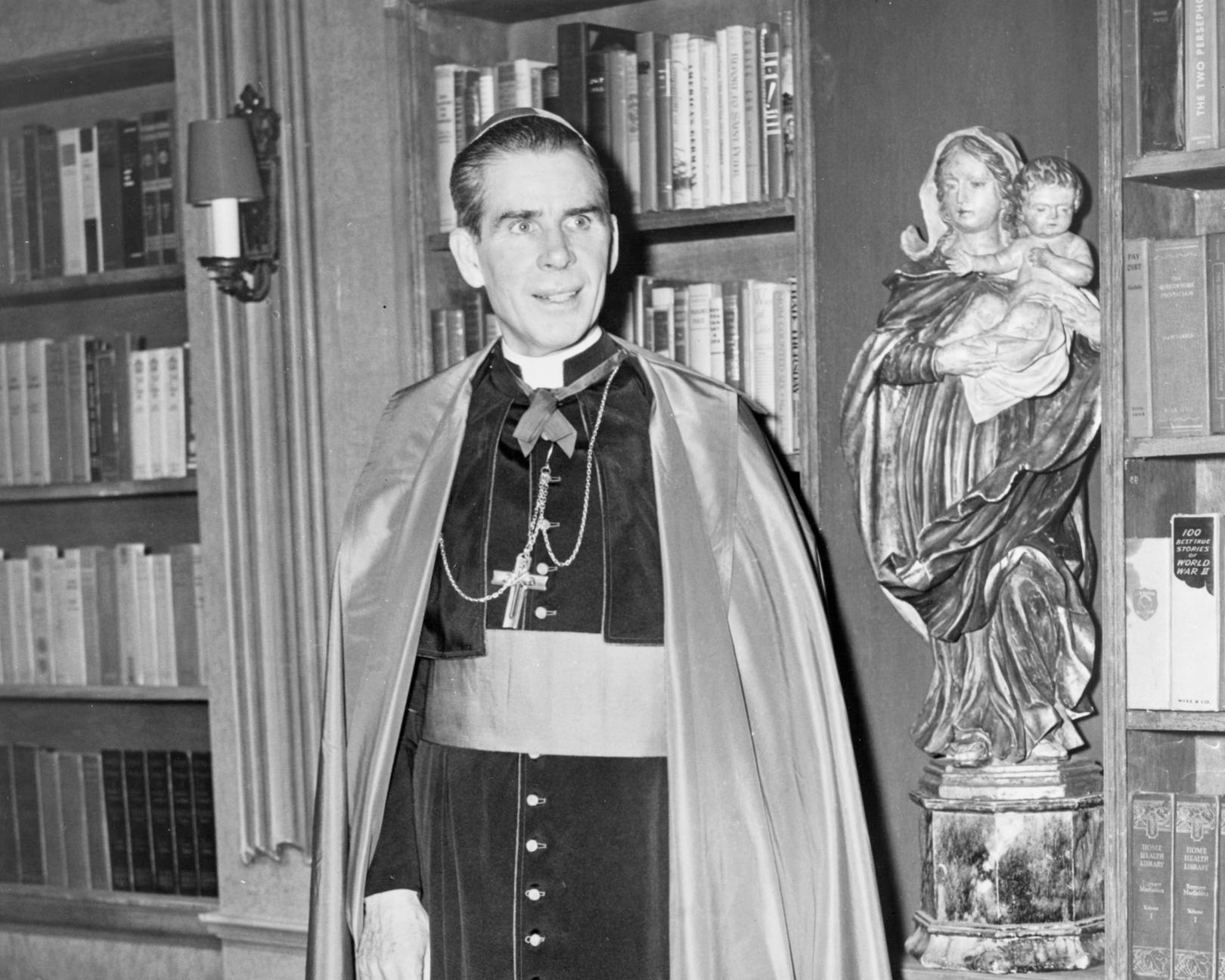 Photograph of Fulton J. Sheen, Roman Catholic Bishop and early television preacher, on a set for one of his regular television series. 1952, photograph. photographed by Fred Palumbo. Library of Congress / Wikimedia Commons