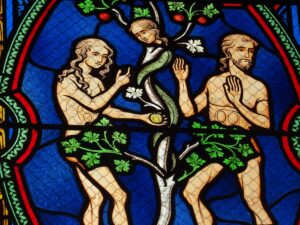 Adam and Eve, The Fruit, and the Serpent. Stained glass, Basilique Notre-Dame des Enfants / Wikimedia Commons.