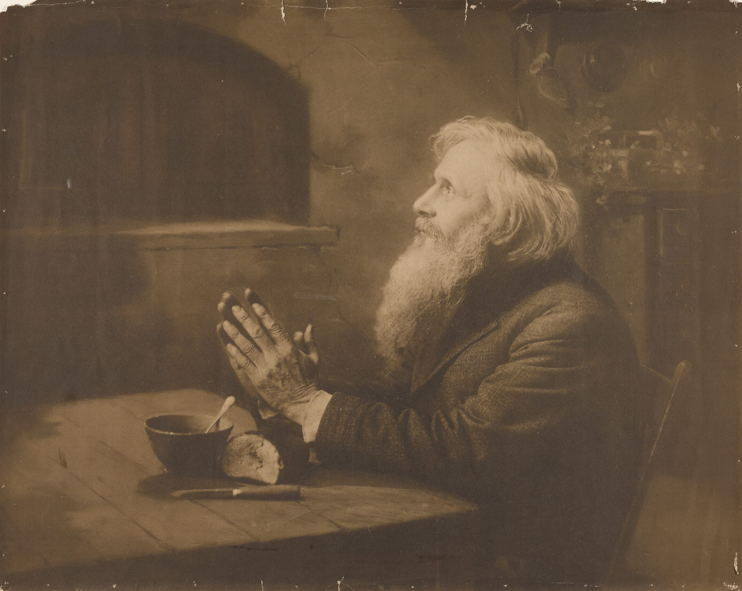 Man praying over meal by Rudolf Eickemeyer Jr. (1862-1932). 1900, gelatin silver print, Getty Center / Wikimedia Commons