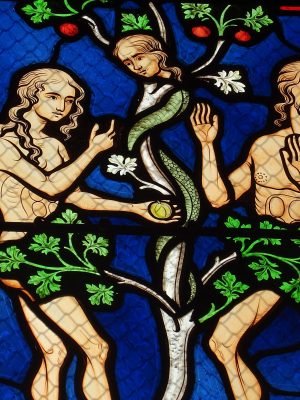 Adam and Eve, The Fruit, and the Serpent. Stained glass, Basilique Notre-Dame des Enfants / Wikimedia Commons.